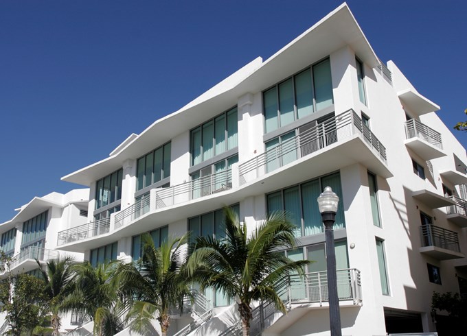 A white building with palm trees